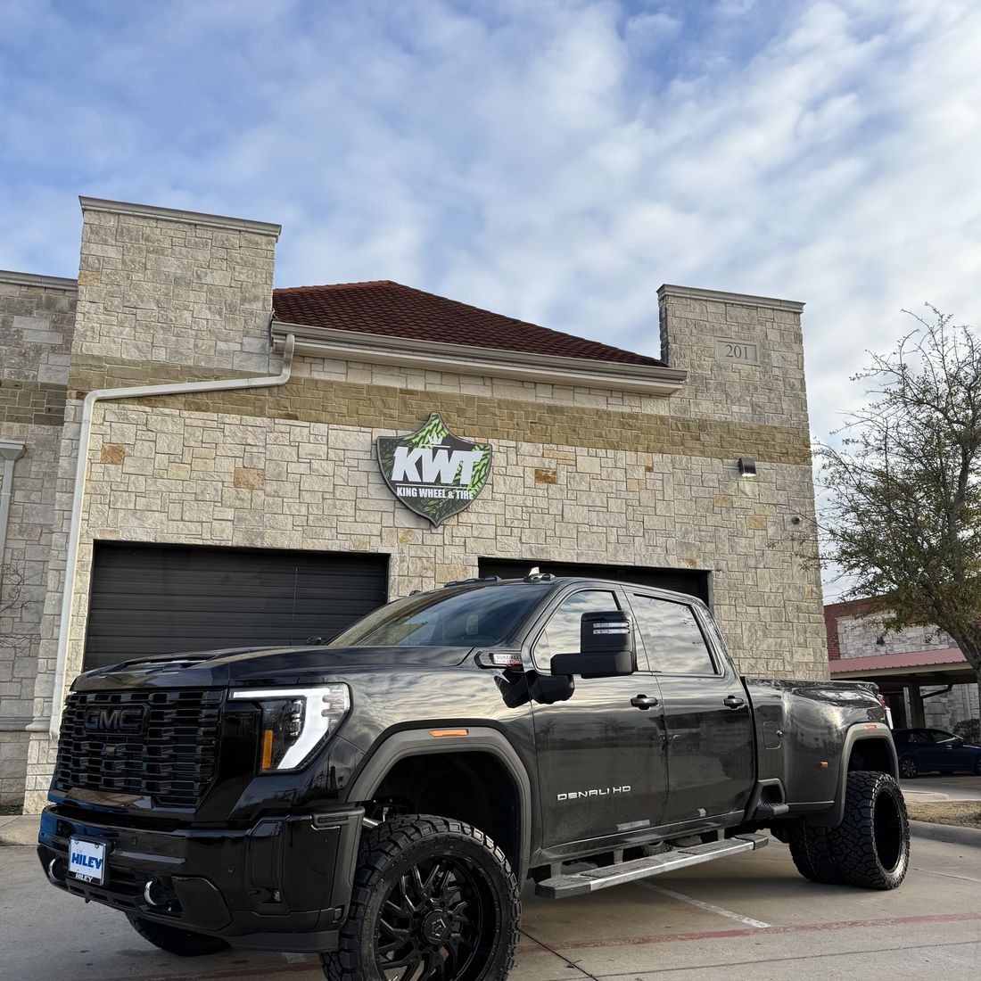 Lifted black GMC Denali HD dually at King Wheel & Tire in Mansfield, TX